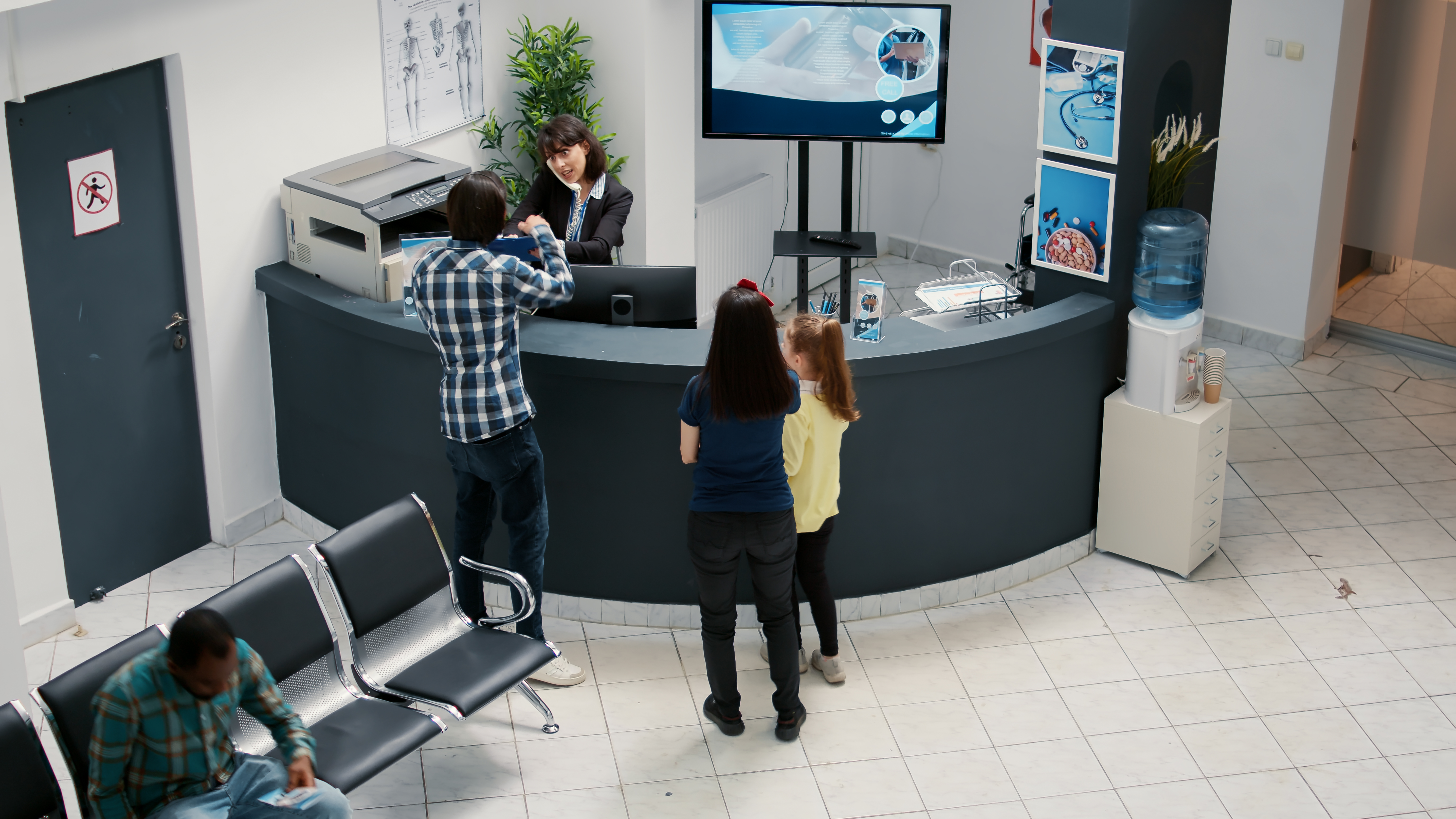 Busy hospital reception and waiting area with diverse patients