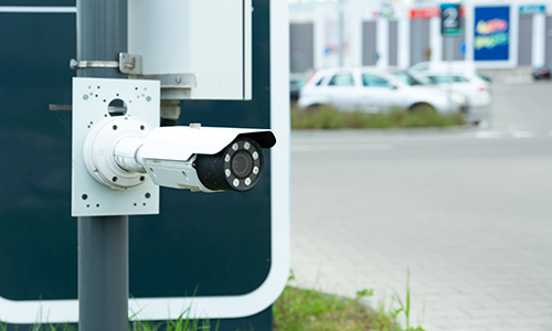 Modern CCTV camera at the entrance to the car park